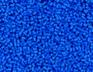 Blue-dyed polymers and elastomers in bulk.