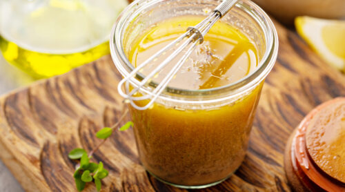 Homemade greek salad dressing or marinade in a glass jar
